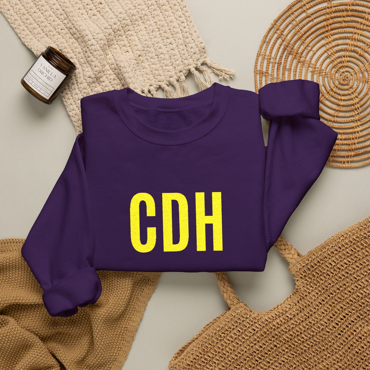 Cretin Derham Hall Crewneck Sweatshirt — Bold Yellow “CDH” Embroidered Logo on Purple