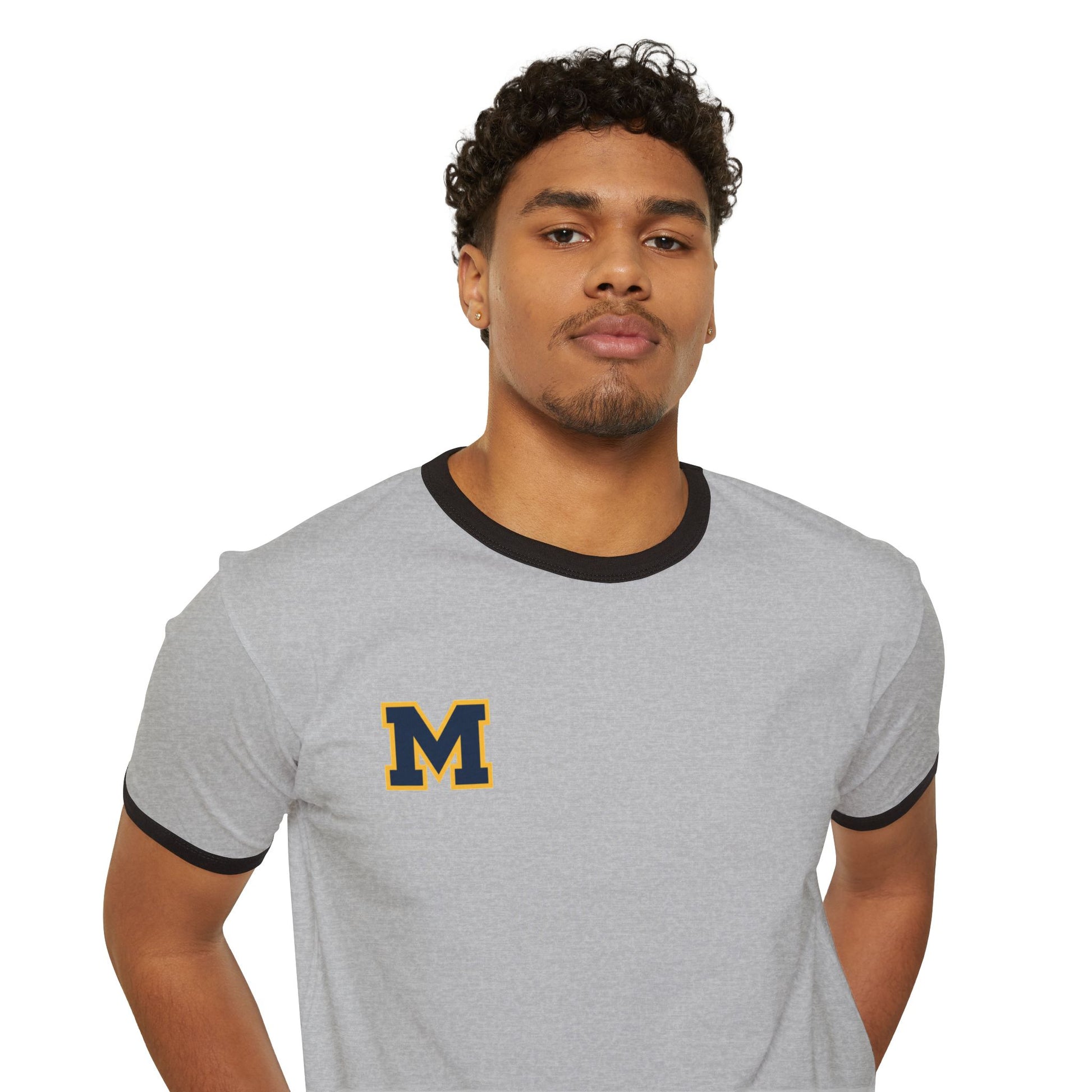 Man wearing a gray Mahtomedi Zephyrs vintage collegiate ringer tee with a dark collar and an emblem on the chest.