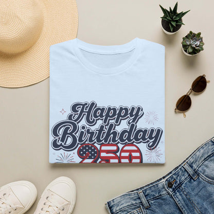 Happy Birthday America T-Shirt displayed on a flat lay with decorative items, celebrating the 250th anniversary.