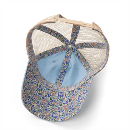 Minnetonka women's cap featuring a floral pattern and washed mesh-back design, perfect for casual outings.