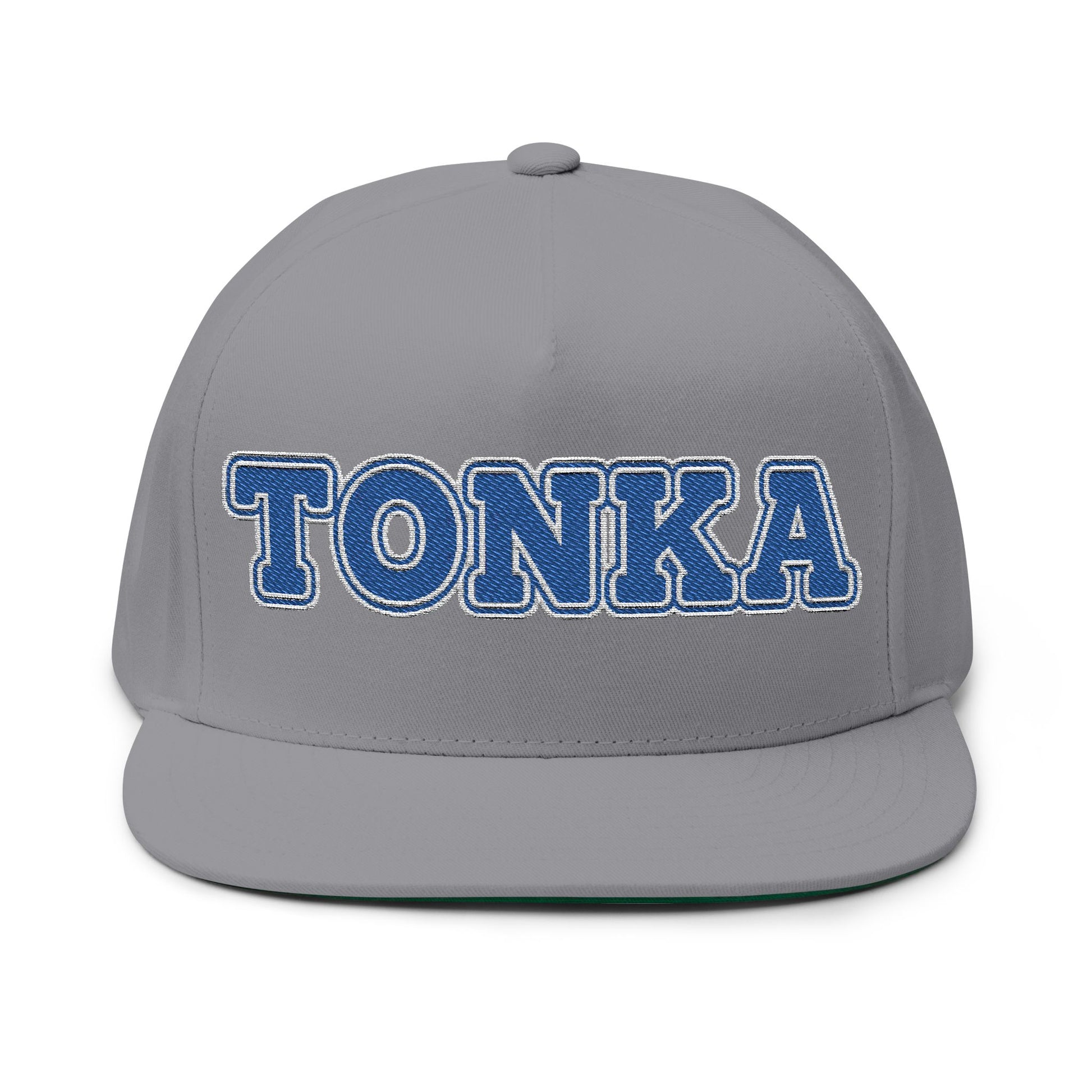 Minnetonka flat bill cap with embroidered TONKA text on a gray background, perfect for showcasing local pride.