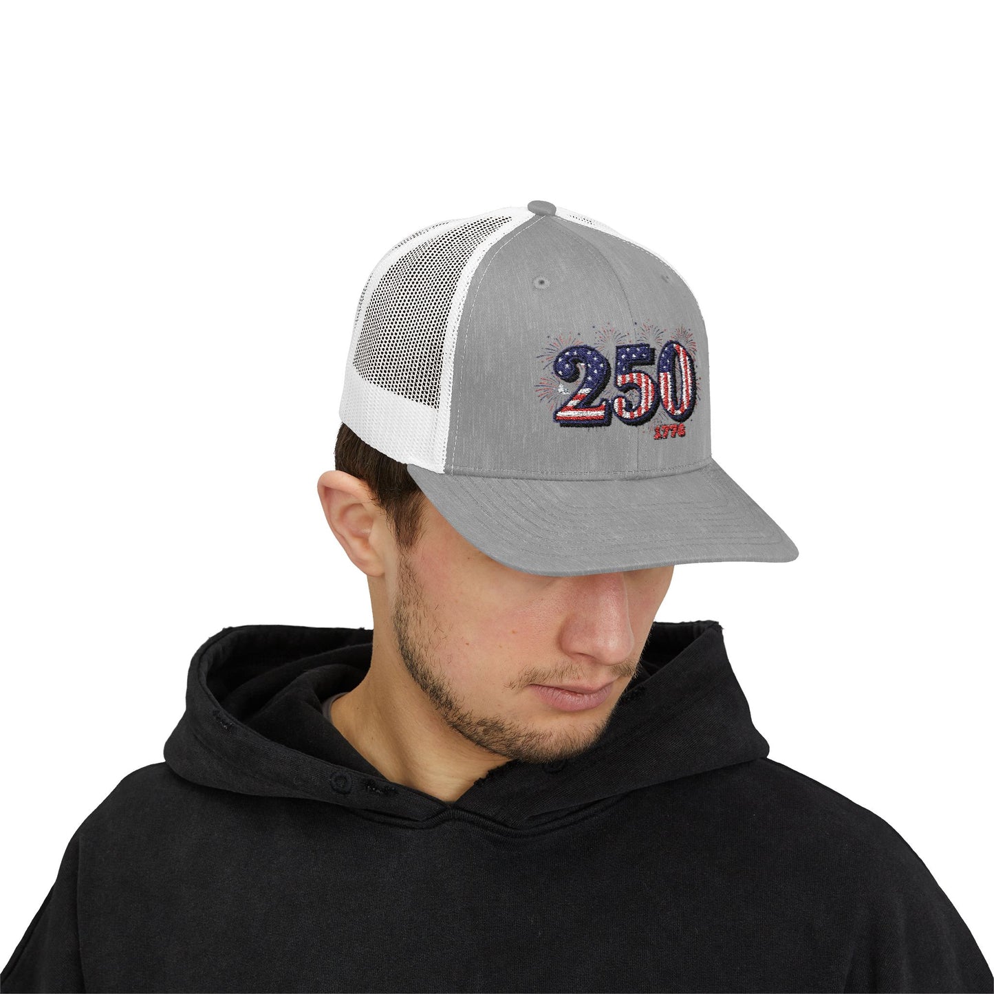 Man wearing an America 250th anniversary cap with gray front and mesh back, celebrating American pride.